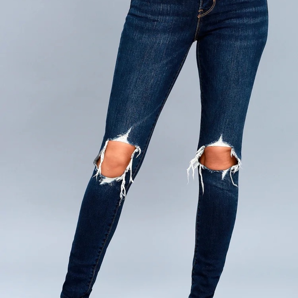 Dark wash, distressed Levi’s